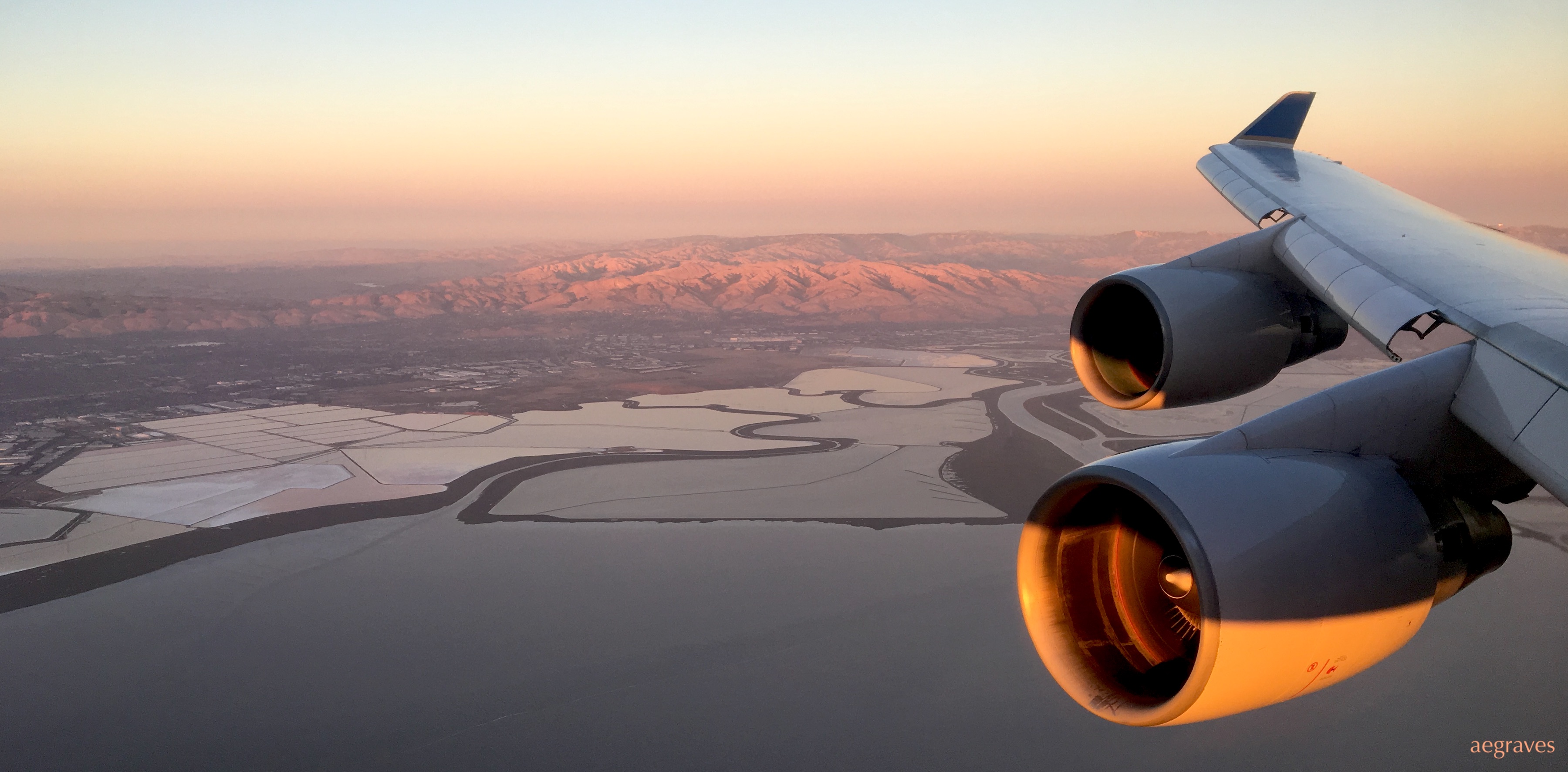 photo of a plane with over San Francisco Bay by A.E. Graves